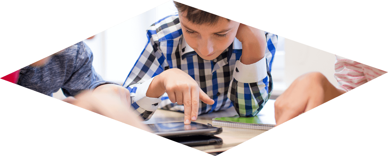 Photo - Boy using a computer tablet