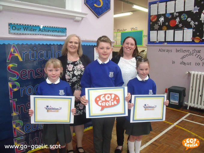 Proud finalists: Head teacher Alison McFarlane, back left, and teacher Rachel Neilly with, from left to right, pupils Paige Hamilton, Graham Forrester and Freya Hamilton.